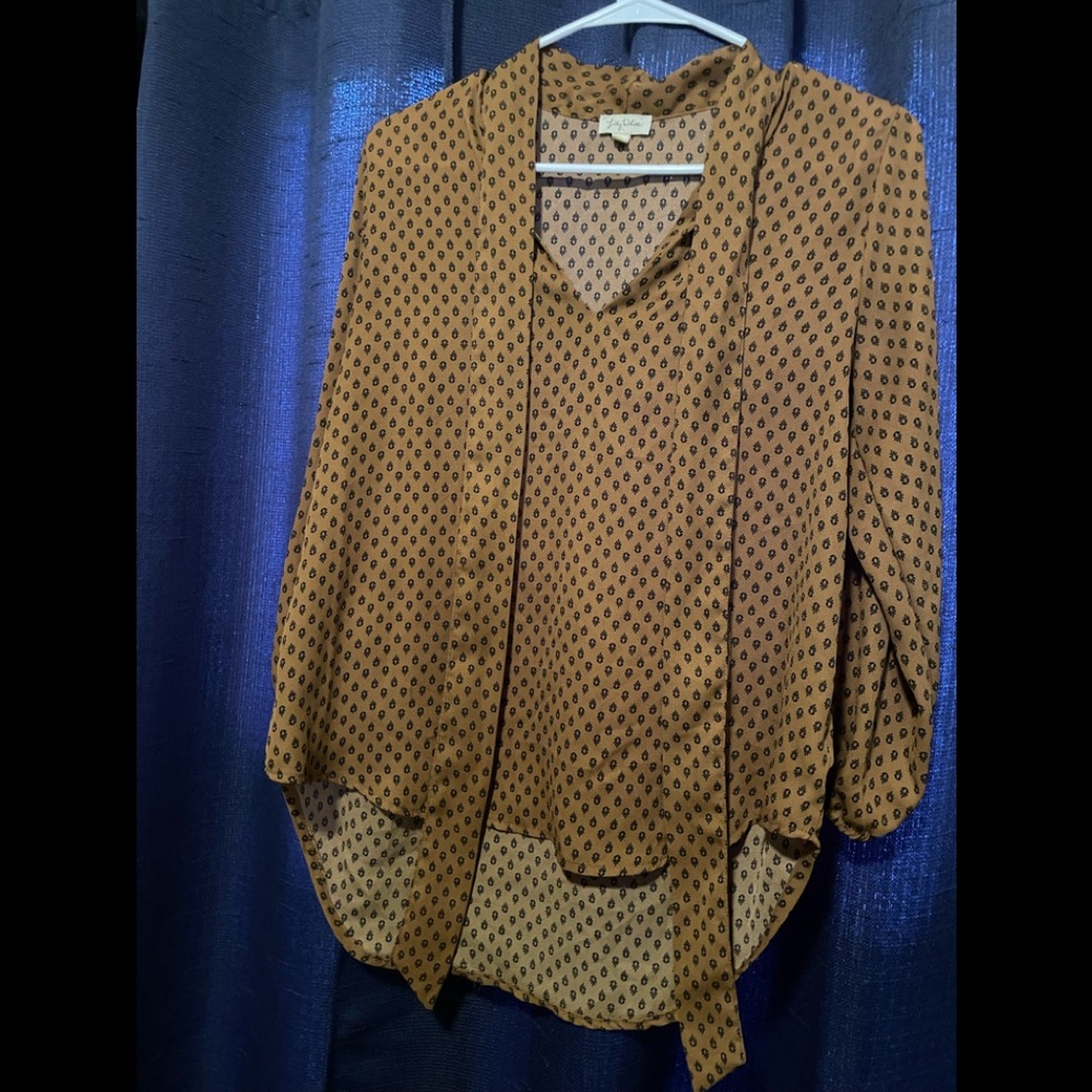 Lily White pattern top with tie detail.